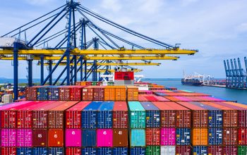 Container ship loading and unloading in sea port, Aerial view of business logistic import and export freight  transportation by container ship in harbor, Container loading Cargo freight ship, Dubai.